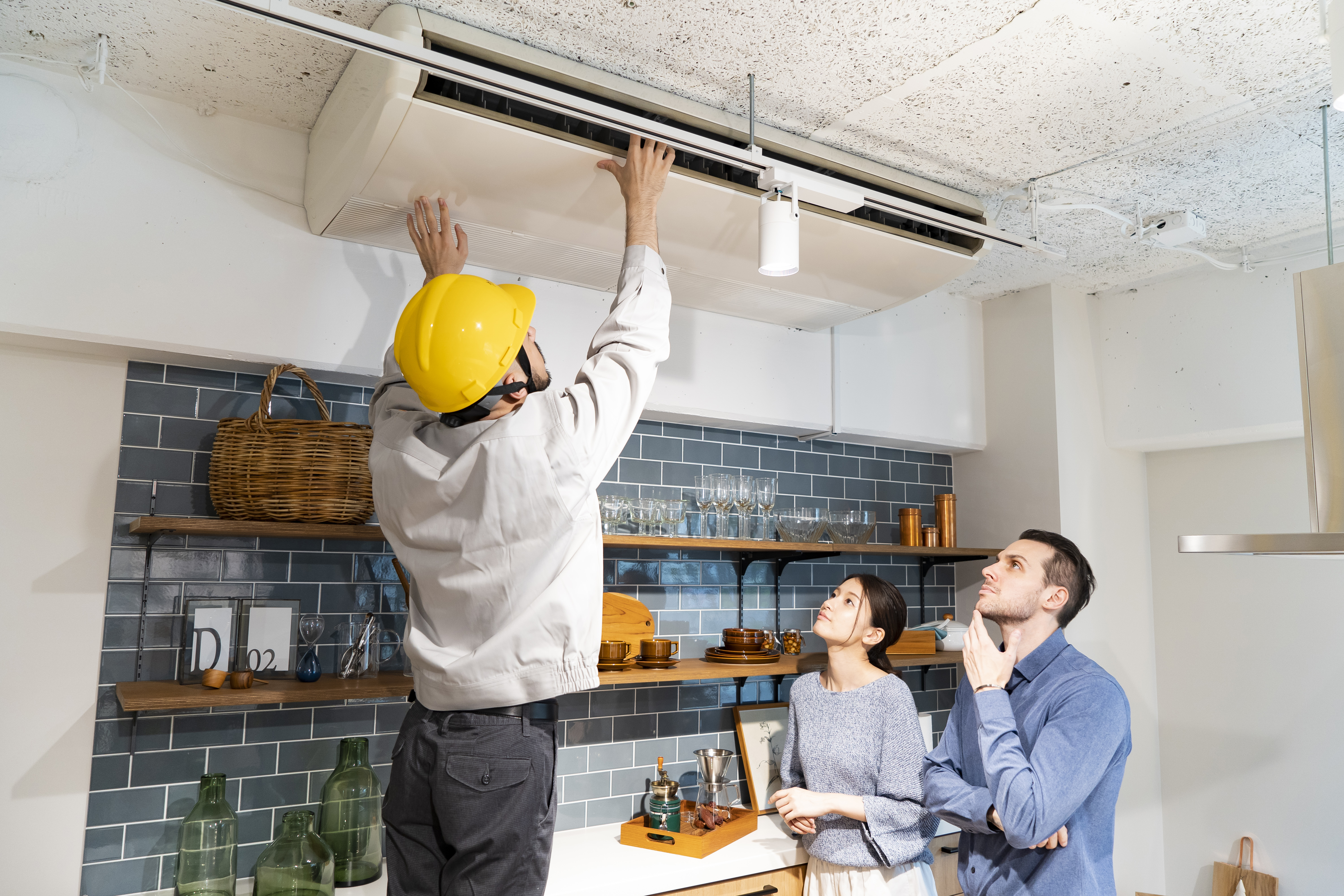 repairman-checking-air-conditioner